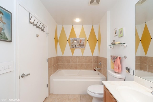 bathroom featuring a bath, tile patterned floors, toilet, and vanity