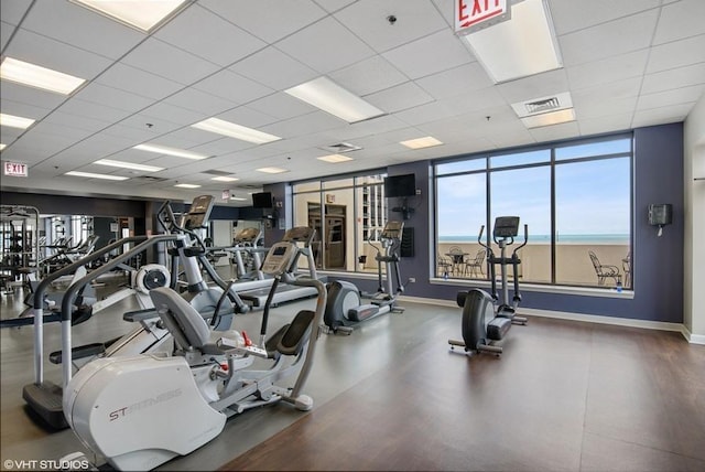 workout area featuring a drop ceiling