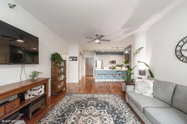 living room with hardwood / wood-style flooring, ceiling fan, and track lighting