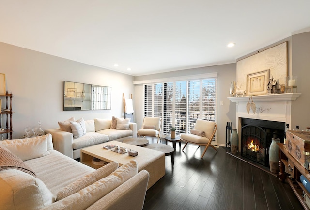 living room with crown molding and dark wood-type flooring