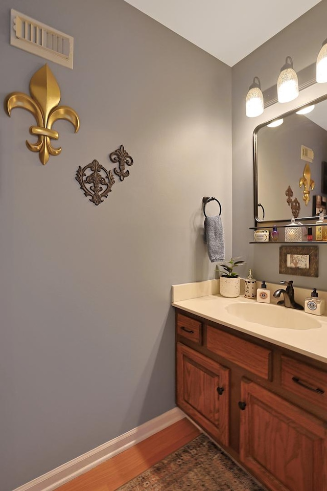 bathroom featuring vanity and wood-type flooring