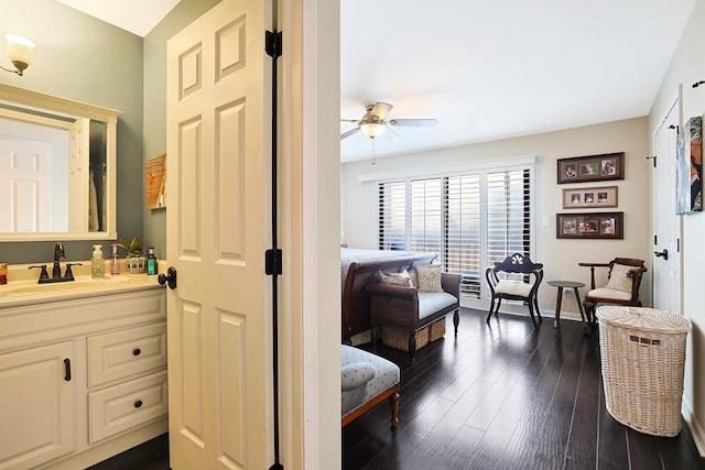 bathroom featuring vanity, hardwood / wood-style flooring, and ceiling fan