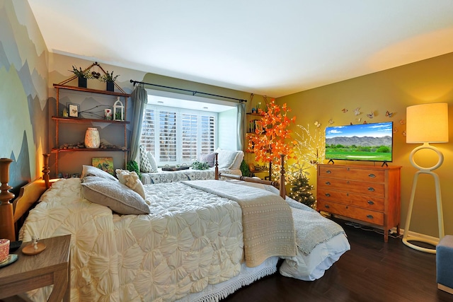 bedroom featuring dark hardwood / wood-style flooring