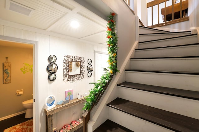 staircase with beam ceiling