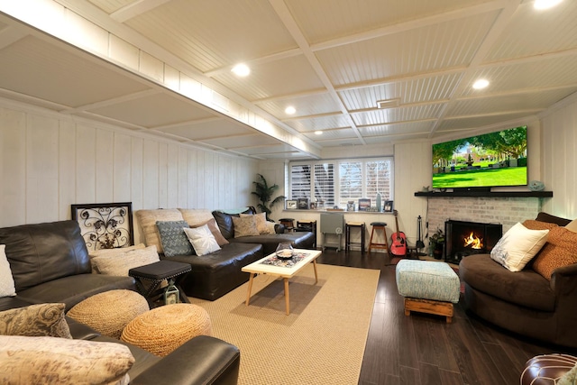 living room with a fireplace and wood-type flooring