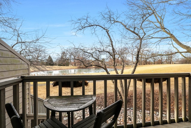 wooden deck with a water view