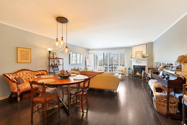 dining area featuring ornamental molding and dark hardwood / wood-style flooring