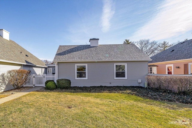 back of house with a yard