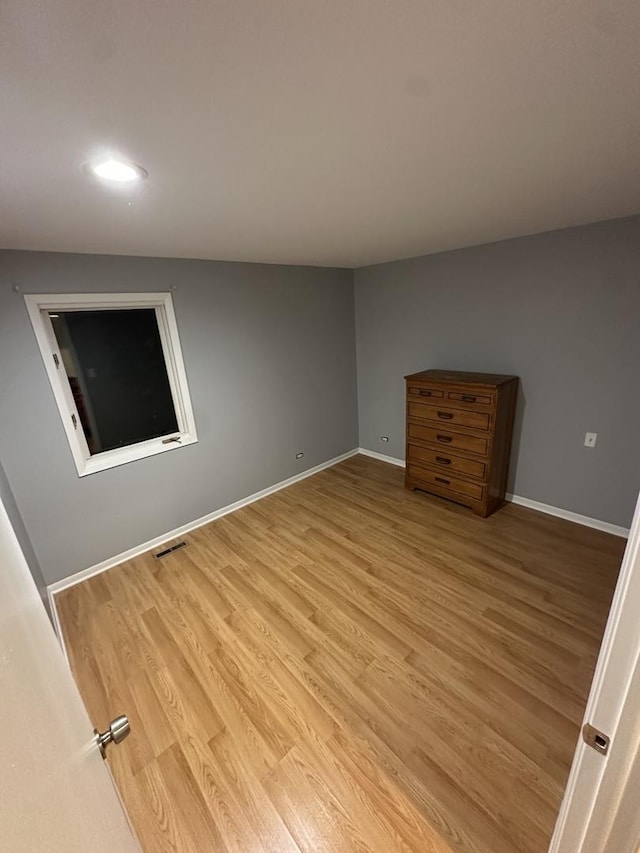 unfurnished bedroom featuring light wood-type flooring