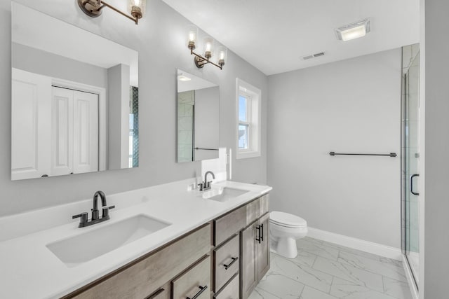 bathroom featuring walk in shower, vanity, and toilet