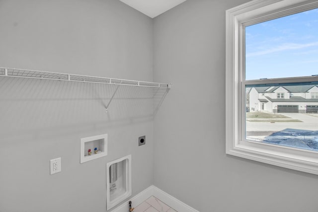 laundry area featuring plenty of natural light, hookup for a washing machine, and electric dryer hookup