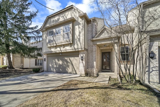 view of front facade featuring a garage, brick siding, and driveway