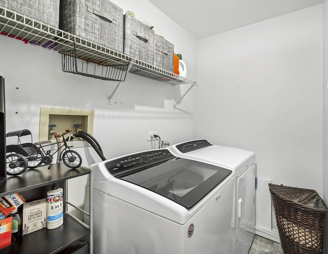 laundry area with washer and clothes dryer and laundry area