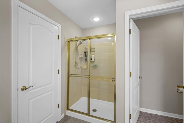 full bathroom featuring recessed lighting, baseboards, and a stall shower