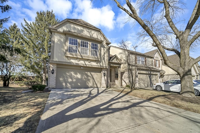 view of front of property with brick siding, an attached garage, and concrete driveway