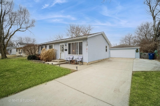 single story home featuring an outbuilding, a garage, and a front yard