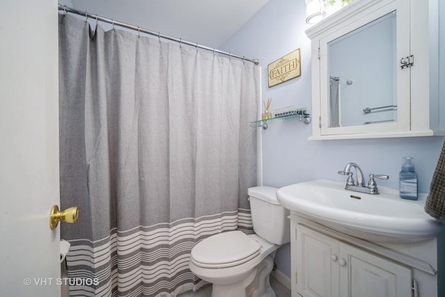 bathroom with vanity, toilet, and a shower with shower curtain