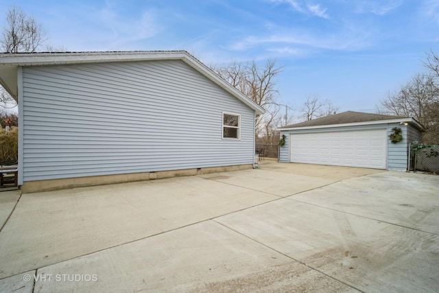 view of home's exterior featuring a garage and an outdoor structure