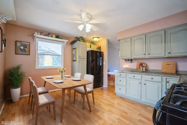 kitchen with ceiling fan, light wood-type flooring, and black appliances