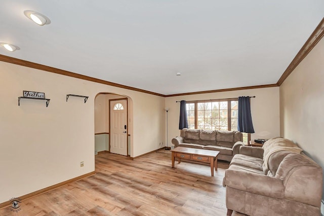 living room featuring crown molding and light hardwood / wood-style flooring