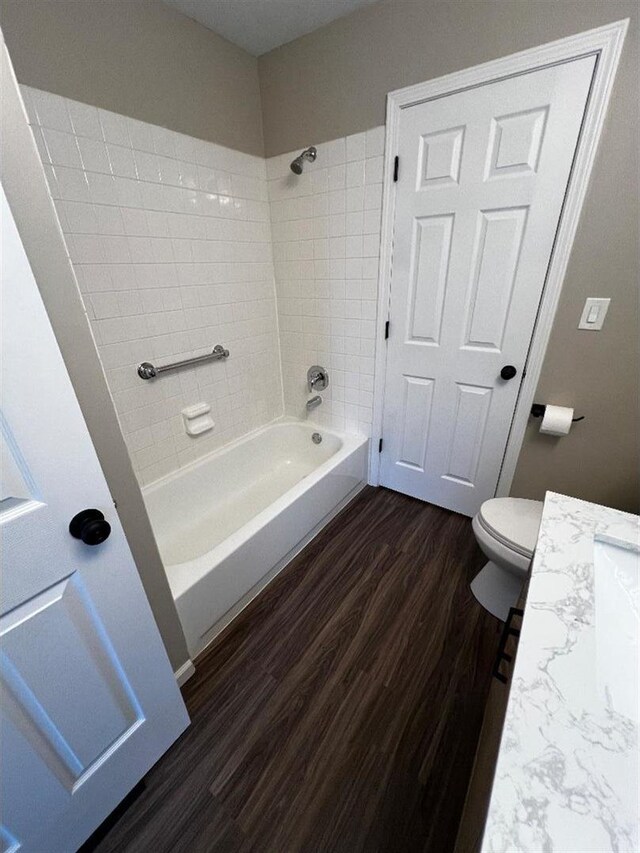 unfurnished room with lofted ceiling and dark colored carpet