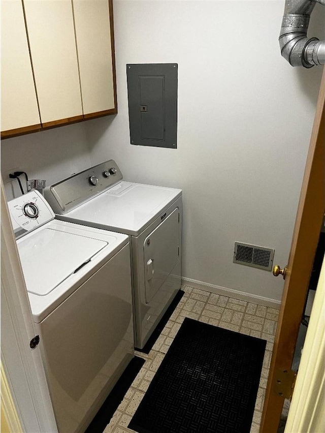 laundry area with light floors, cabinet space, visible vents, washing machine and dryer, and electric panel