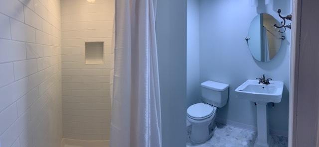 bathroom featuring sink and toilet