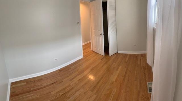 empty room with light wood-type flooring