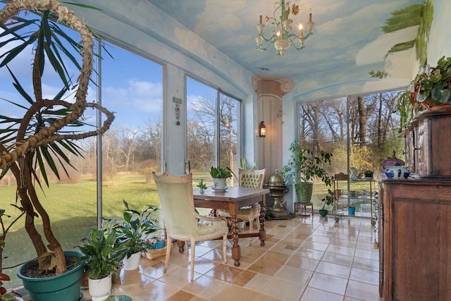 sunroom / solarium featuring a notable chandelier