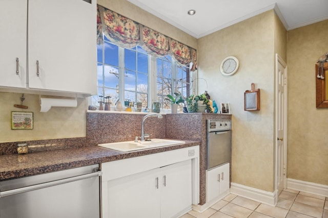 kitchen with light tile patterned flooring, sink, white cabinetry, crown molding, and stainless steel dishwasher