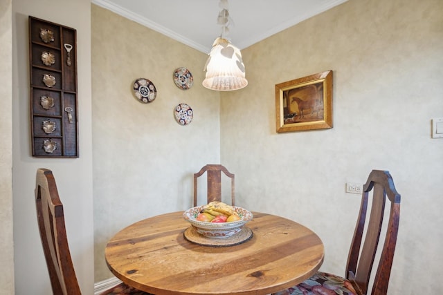 dining area featuring ornamental molding