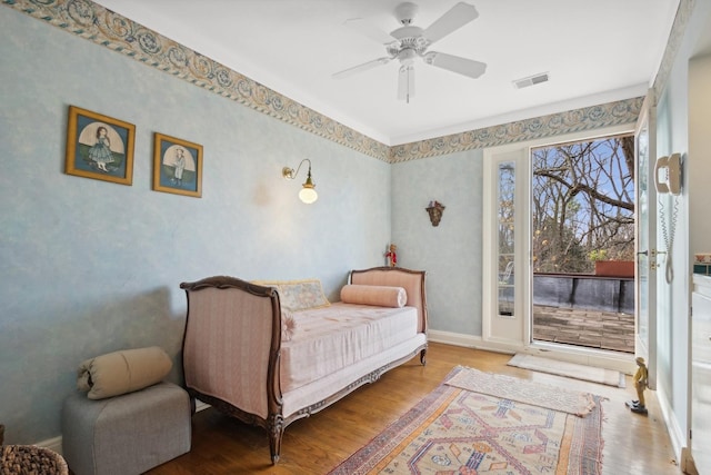 bedroom with ceiling fan, hardwood / wood-style floors, and access to outside