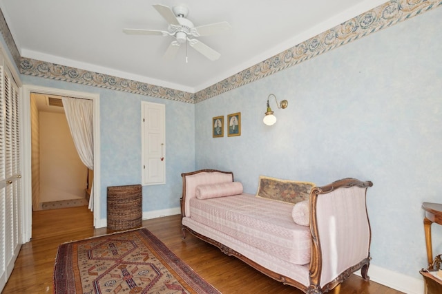 bedroom with hardwood / wood-style flooring and ceiling fan