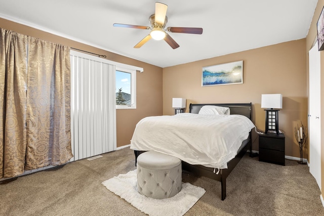 bedroom with ceiling fan and carpet flooring