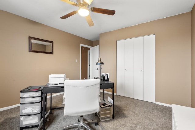 carpeted home office with ceiling fan