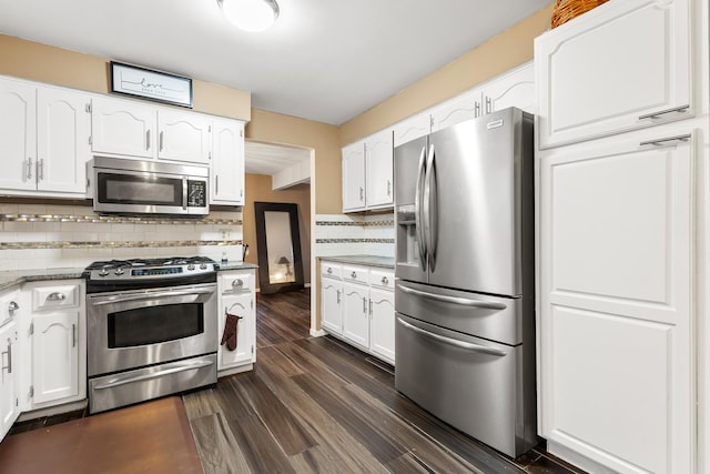 kitchen featuring tasteful backsplash, stainless steel appliances, dark hardwood / wood-style floors, and white cabinets