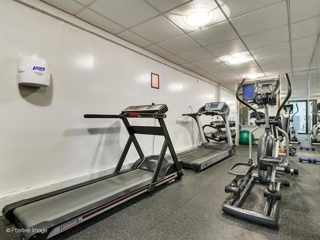 workout area with a drop ceiling