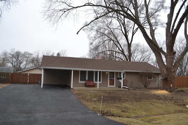 ranch-style house with a carport