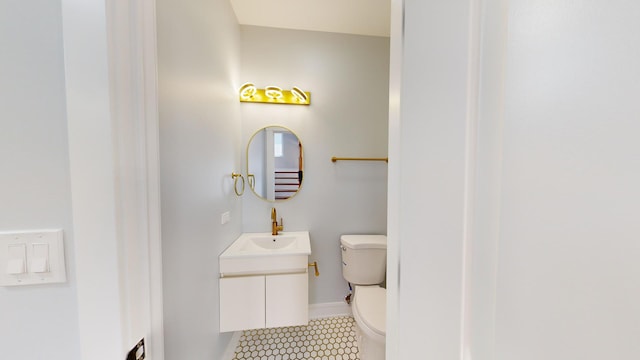 bathroom featuring tile patterned flooring, sink, and toilet