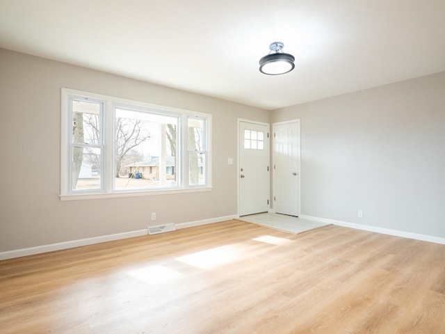 interior space with a healthy amount of sunlight and light hardwood / wood-style flooring