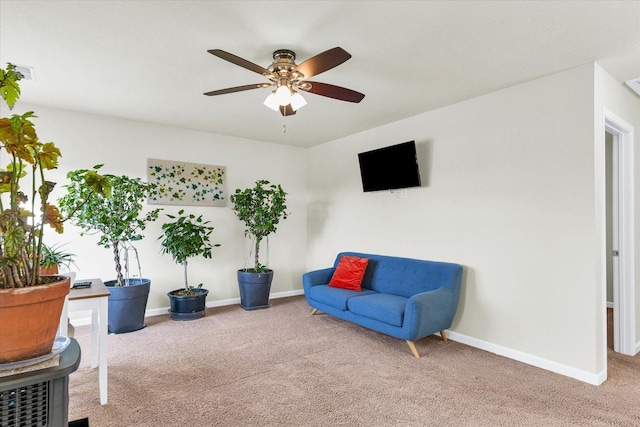 sitting room with carpet, visible vents, and baseboards