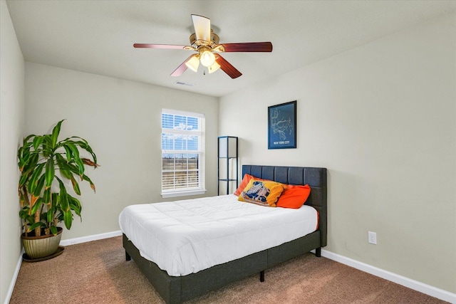 bedroom featuring dark colored carpet, visible vents, and baseboards