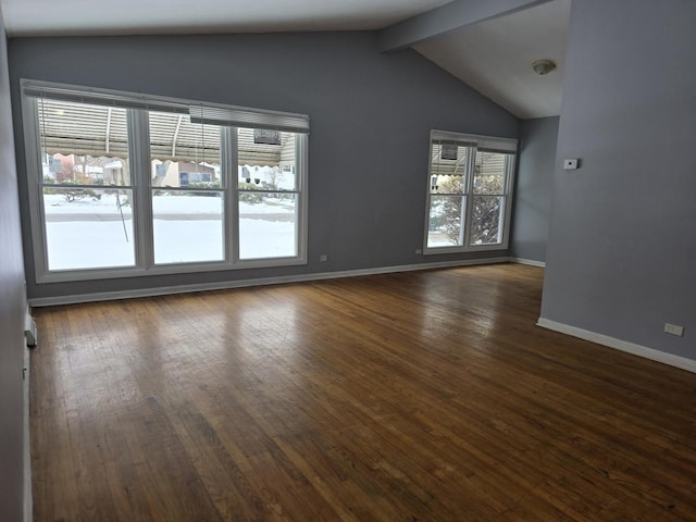 unfurnished room featuring dark hardwood / wood-style floors and vaulted ceiling with beams