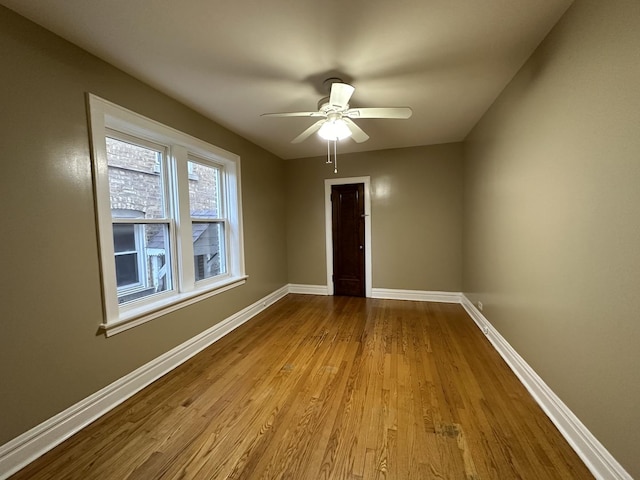 unfurnished room with ceiling fan and light hardwood / wood-style flooring