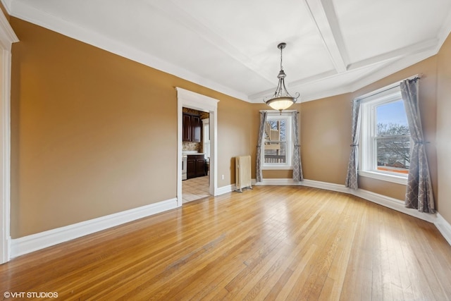 interior space with radiator heating unit, light hardwood / wood-style floors, and beamed ceiling