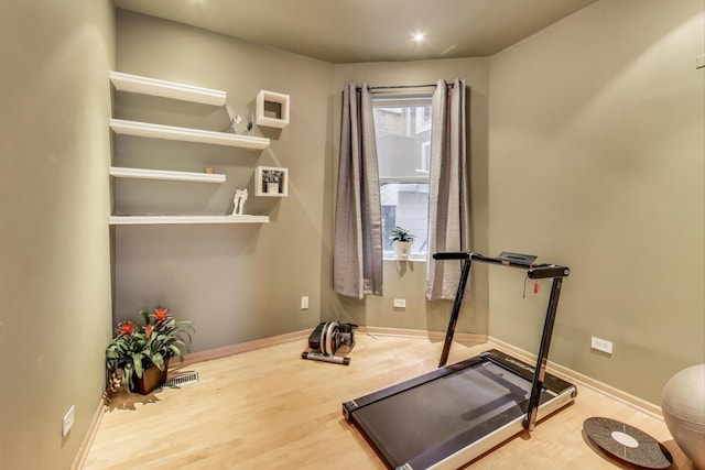 exercise room featuring hardwood / wood-style flooring