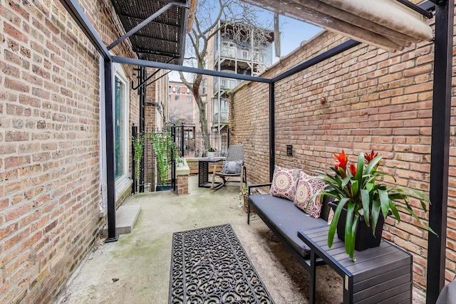 view of patio / terrace with a balcony and outdoor lounge area