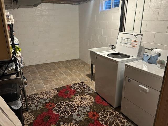 clothes washing area featuring washer and dryer