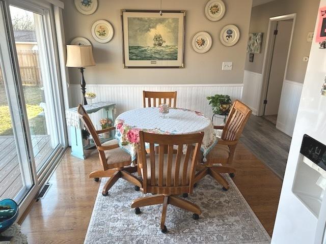 dining area with wood-type flooring