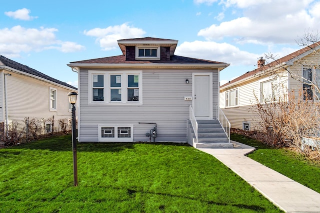 view of front of home with a front yard